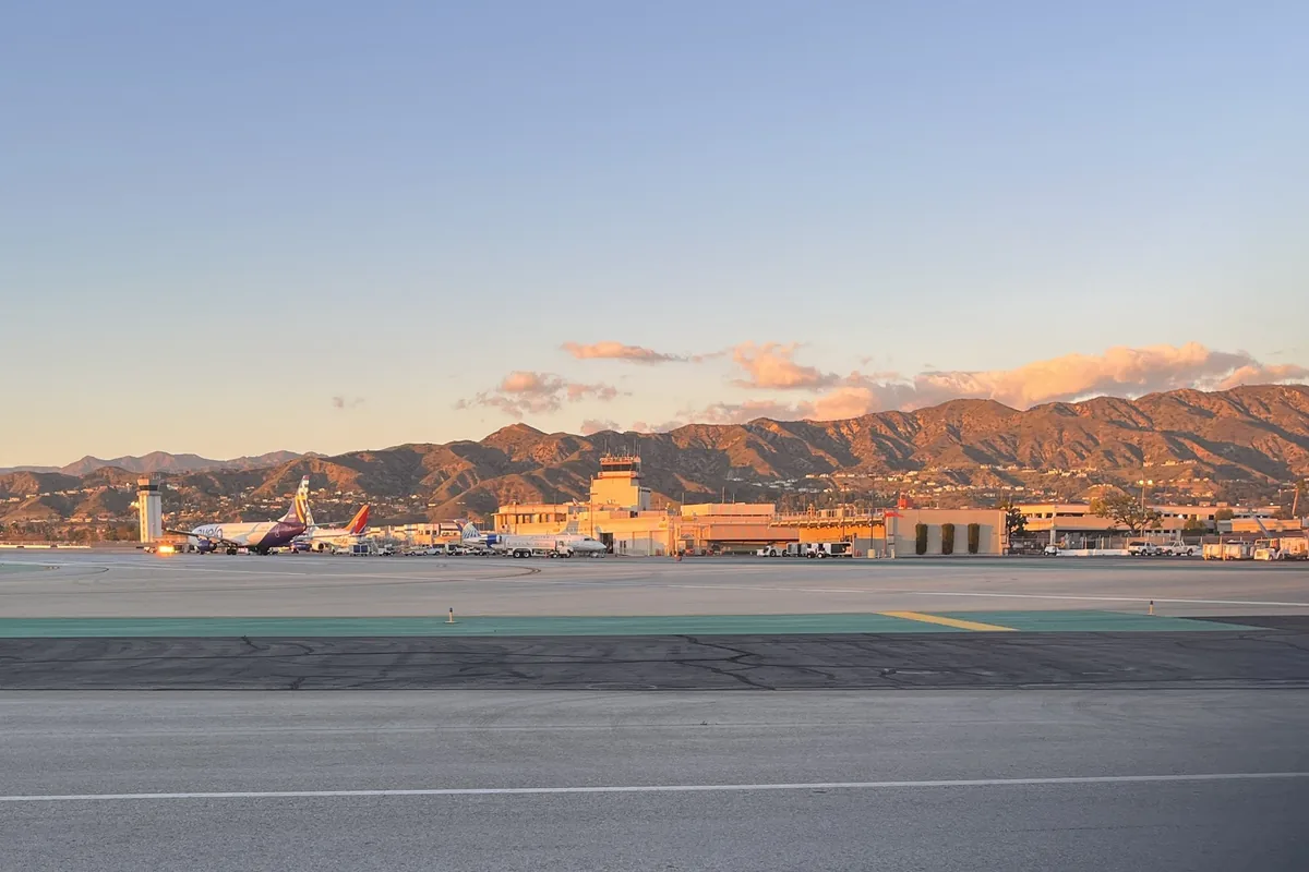 Hollywood Burbank Airport's terminal and runway below the Verdugo Mountains