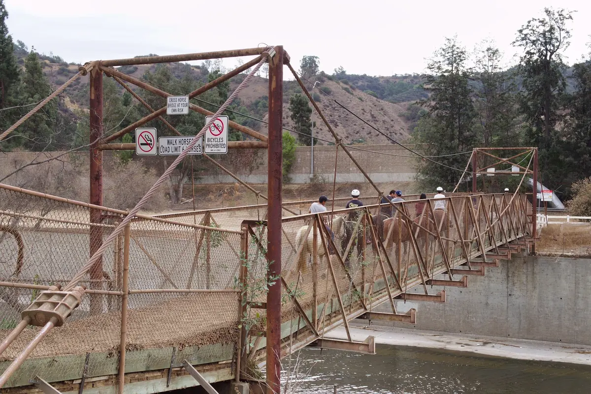 Riders on horseback crossing the Mariposa Street bridge over the Los Angeles River in Burbank